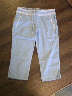 Vintage Nike Light Blue Cropped Track Pants with White Accents